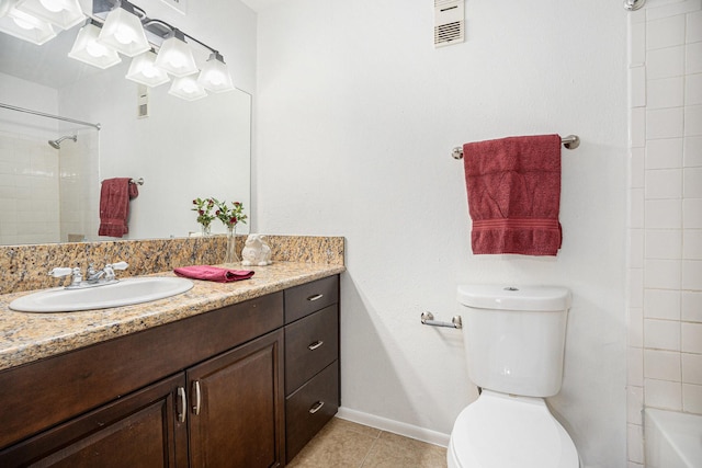 bathroom with vanity, tile patterned floors, and toilet