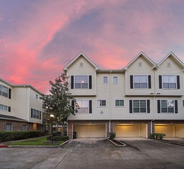 multi unit property featuring a garage