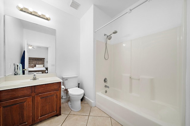 full bathroom featuring toilet,  shower combination, vanity, ceiling fan, and tile patterned flooring