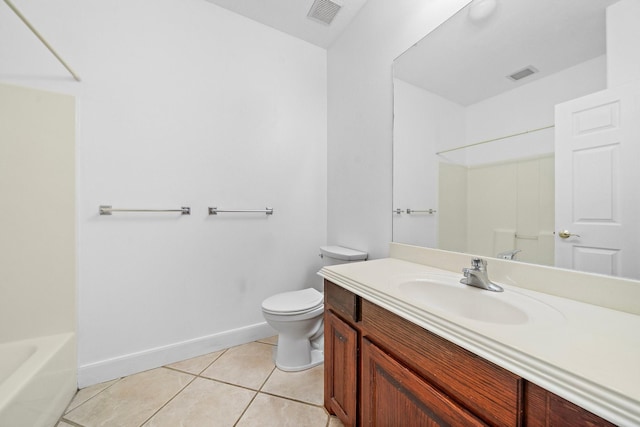 bathroom with vanity, tile patterned floors, and toilet