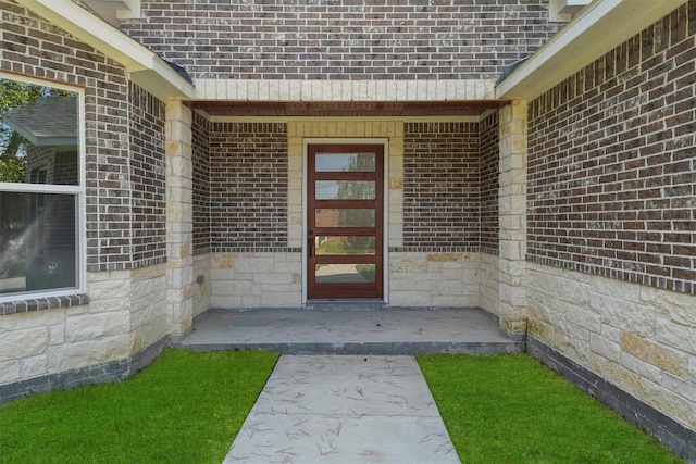 entrance to property featuring a patio area