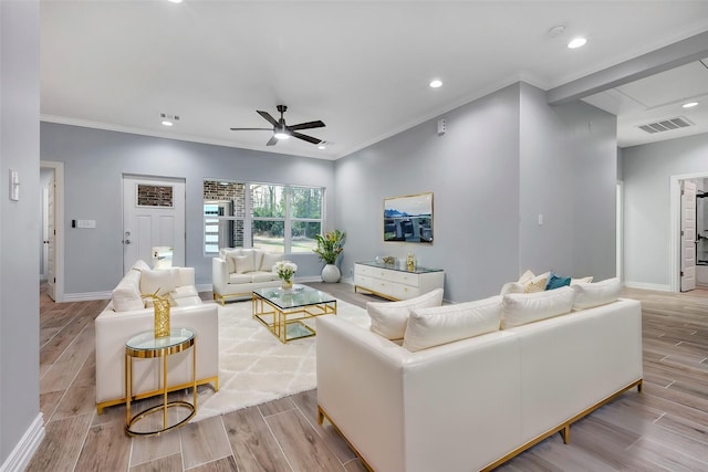 living room featuring ornamental molding, ceiling fan, and light hardwood / wood-style flooring