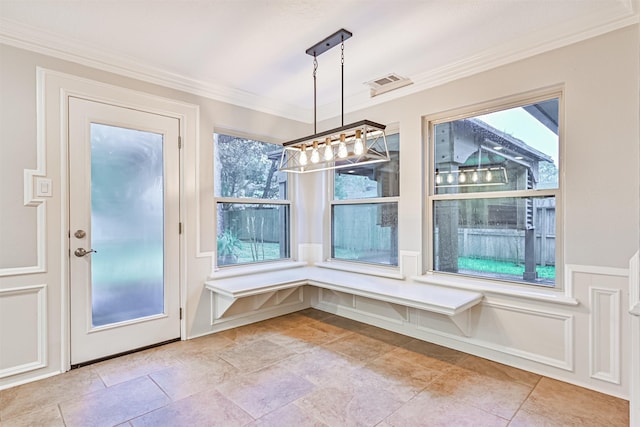 unfurnished dining area featuring crown molding