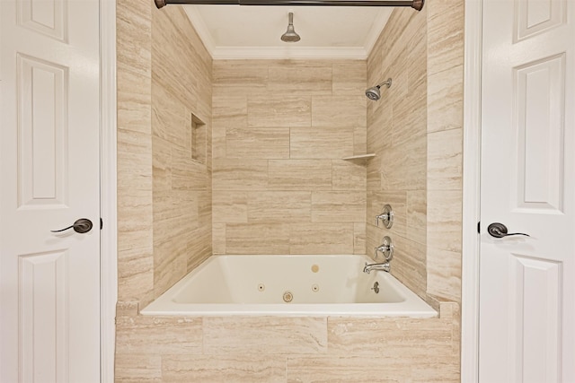 bathroom featuring tiled shower / bath combo and crown molding