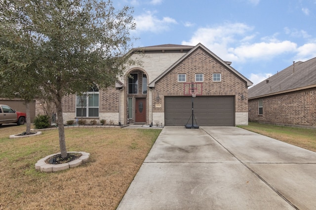 view of property with a garage and a front lawn