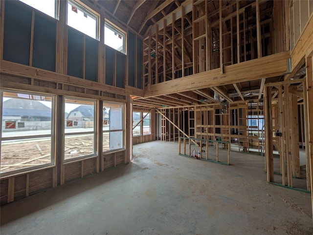 misc room featuring a high ceiling and plenty of natural light