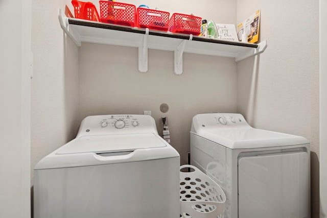 laundry area with washing machine and dryer