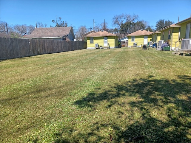 view of yard featuring central air condition unit