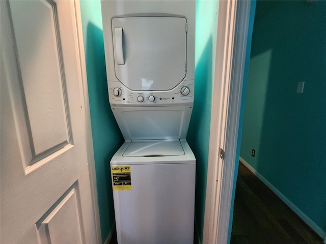 laundry area featuring stacked washer / dryer