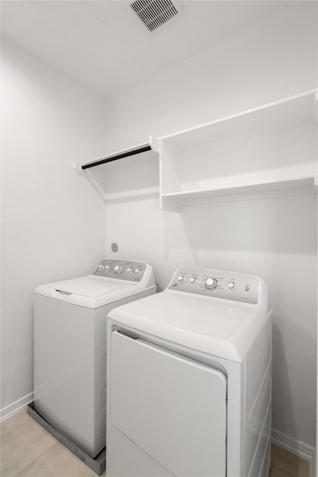 laundry area with washer and clothes dryer