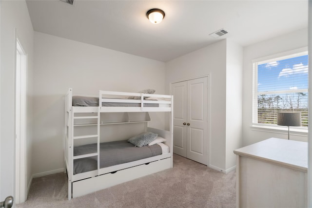 bedroom featuring light colored carpet