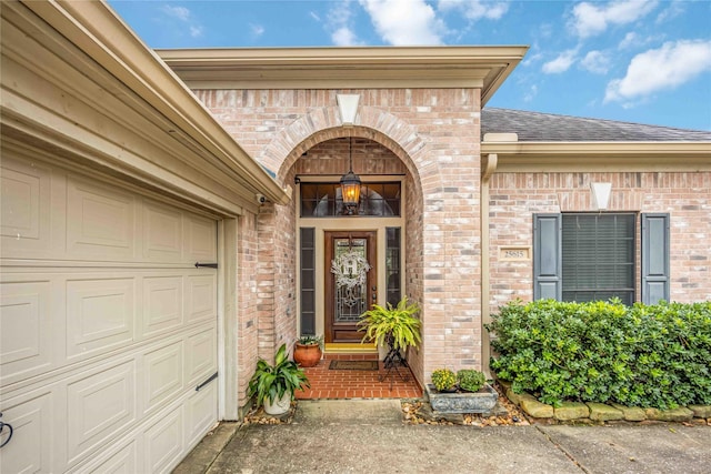 view of exterior entry featuring a garage