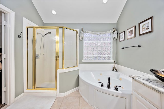 bathroom with independent shower and bath, vanity, lofted ceiling, and tile patterned floors