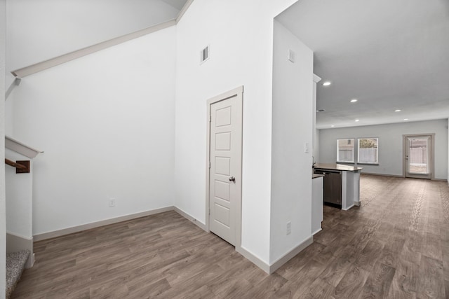 corridor featuring hardwood / wood-style floors