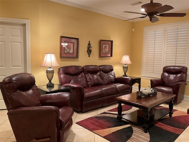 living room featuring ornamental molding, light tile patterned floors, and ceiling fan