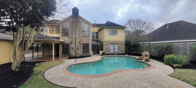 view of swimming pool featuring a patio area