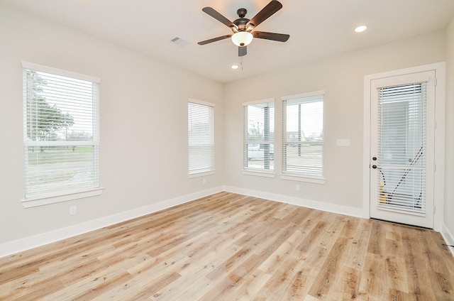 unfurnished room featuring light hardwood / wood-style flooring and ceiling fan