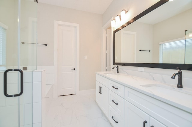 bathroom featuring vanity and an enclosed shower