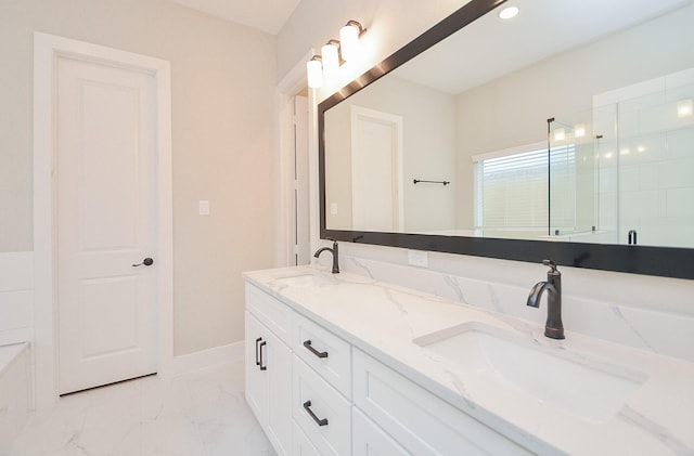 bathroom with vanity and a shower with door