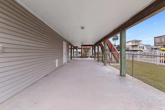 16527 Nassau Way, Jamaica Beach, TX 77554 - view of patio / terrace with stairs, fence, and a residential view