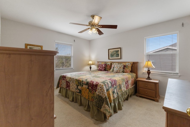 16527 Nassau Way, Jamaica Beach, TX 77554 - bedroom featuring light colored carpet and ceiling fan