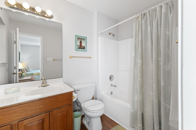 16527 Nassau Way, Jamaica Beach, TX 77554 - ensuite bathroom with toilet, wood finished floors, vanity, ensuite bath, and shower / tub combo with curtain