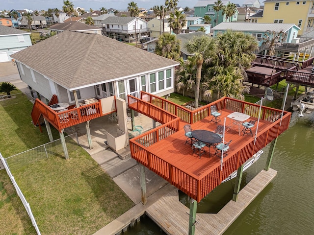 birds eye view of property featuring a residential view and a water view