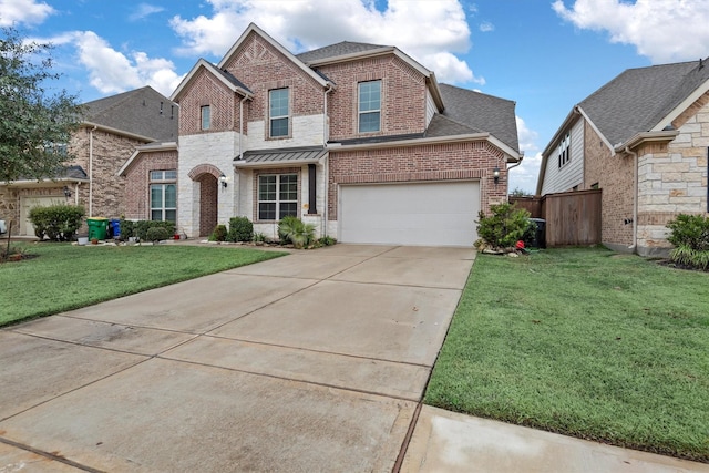 view of front of home featuring a garage and a front yard