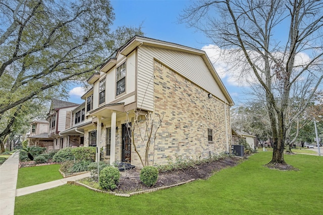 view of property exterior with a yard and central AC unit