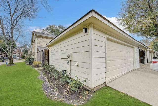 view of property exterior with a garage and a yard