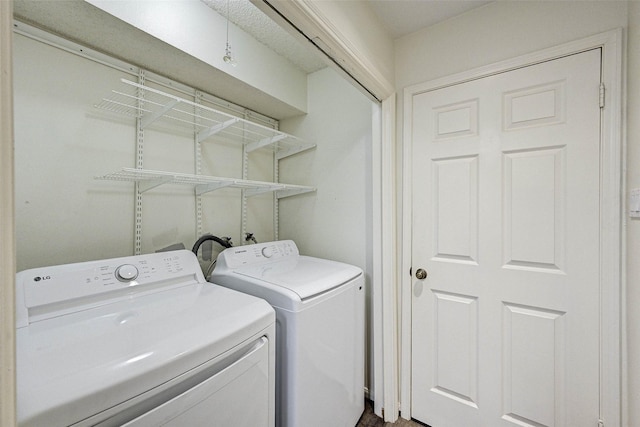 laundry area with separate washer and dryer