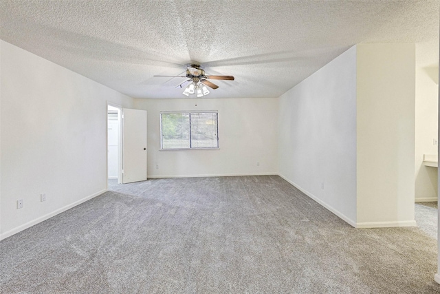 spare room with light carpet, a textured ceiling, and ceiling fan