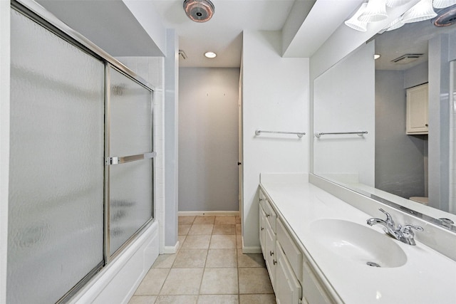 bathroom with vanity, tile patterned floors, and shower / bath combination with glass door