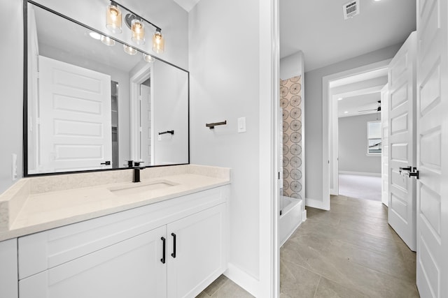 bathroom with vanity, tile patterned floors, and shower / bathing tub combination