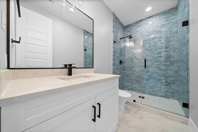 bathroom with vanity, an enclosed shower, and toilet