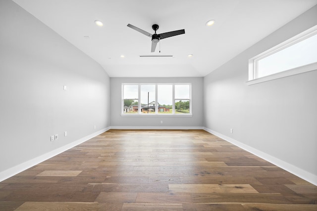 unfurnished living room featuring hardwood / wood-style flooring, ceiling fan, and vaulted ceiling