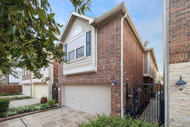 view of side of home with a garage