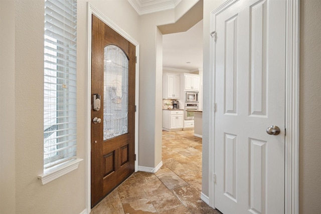 foyer entrance with a wealth of natural light and ornamental molding