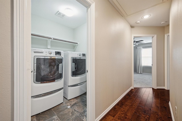 laundry room with washing machine and dryer and dark hardwood / wood-style flooring