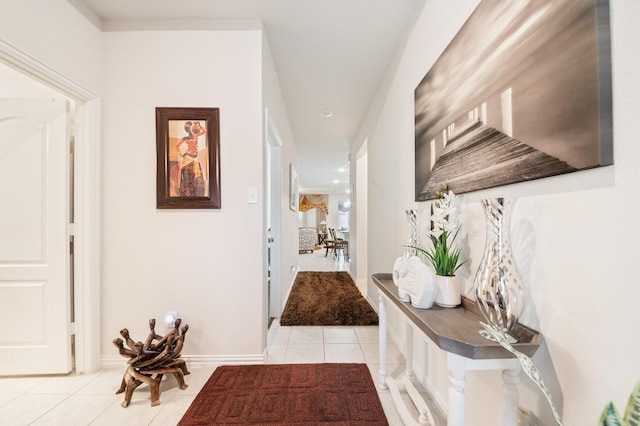 hall with light tile patterned floors