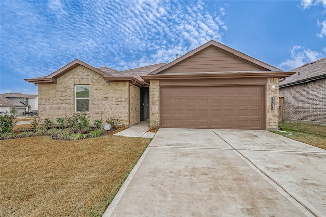 ranch-style house with a garage and a front lawn