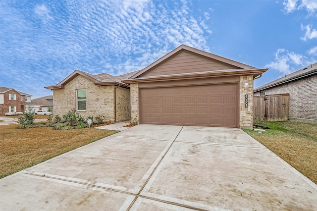 ranch-style house featuring a garage and a front yard