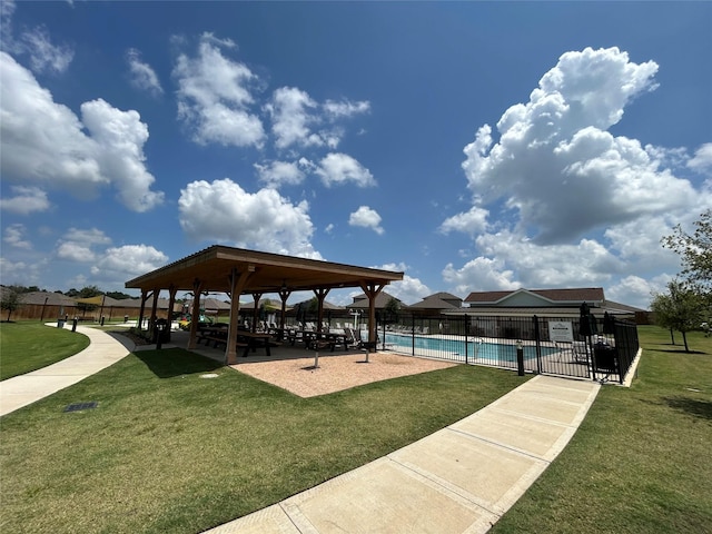 view of home's community with a gazebo, a yard, and a swimming pool