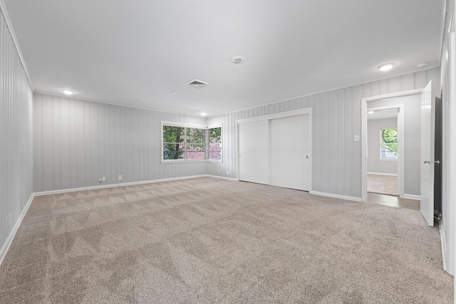 empty room with light colored carpet