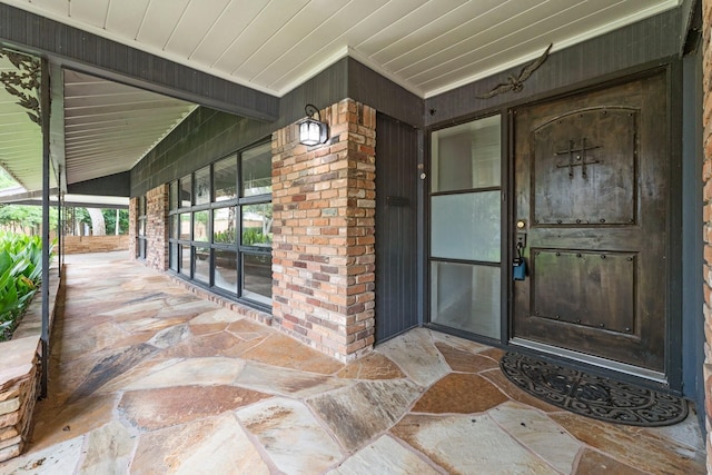 doorway to property with a porch