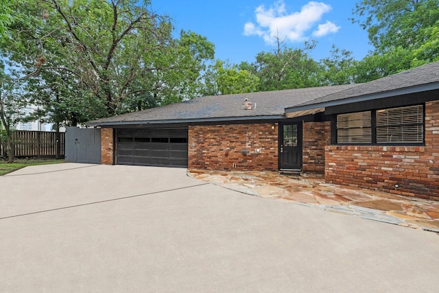 ranch-style home with a garage