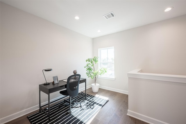 office with dark hardwood / wood-style flooring