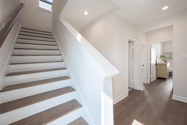 stairway featuring wood-type flooring