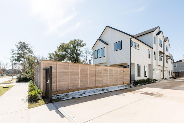 view of side of home with a garage