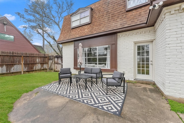 view of patio featuring an outdoor hangout area and a fenced backyard